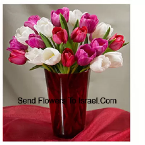 Mixed Colored Tulips With Seasonal Fillers In A Glass Vase - Please Note That In Case Of Non-Availability Of Certain Seasonal Flowers The Same Will Be Substituted With Other Flowers Of Same Value