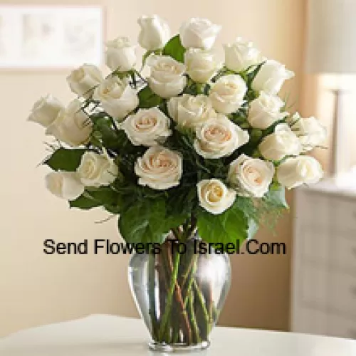 24 White Roses With Some Ferns In A Glass Vase