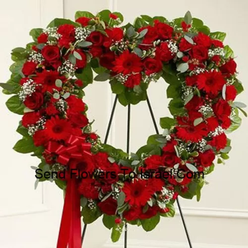A Beautiful Heart Shaped Wreath That Comes With A Stand