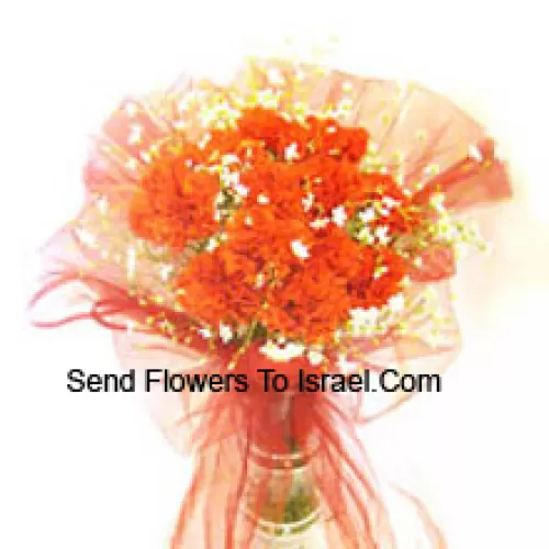 12 Orange Carnations With Some Ferns In A Vase